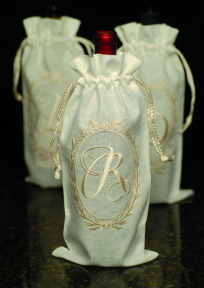 Oval monogram embroidered cream linen wine bags | Gracious Style