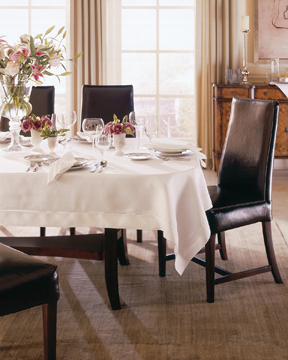 Rectangular tablecloth on oval table